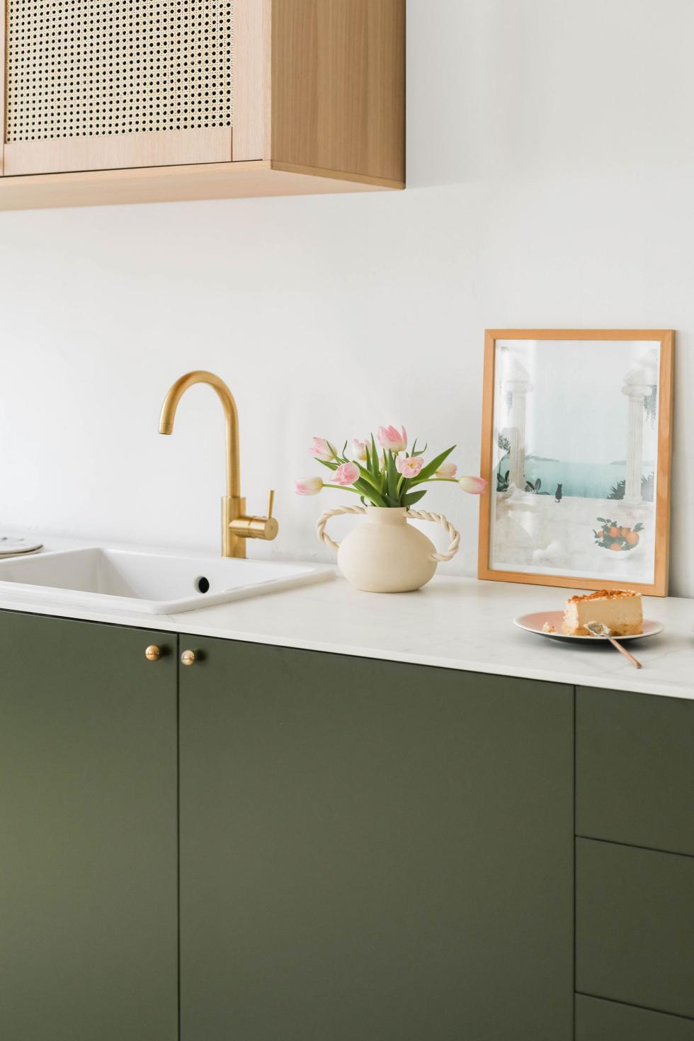 Kitchen in Olive with cane fronts.