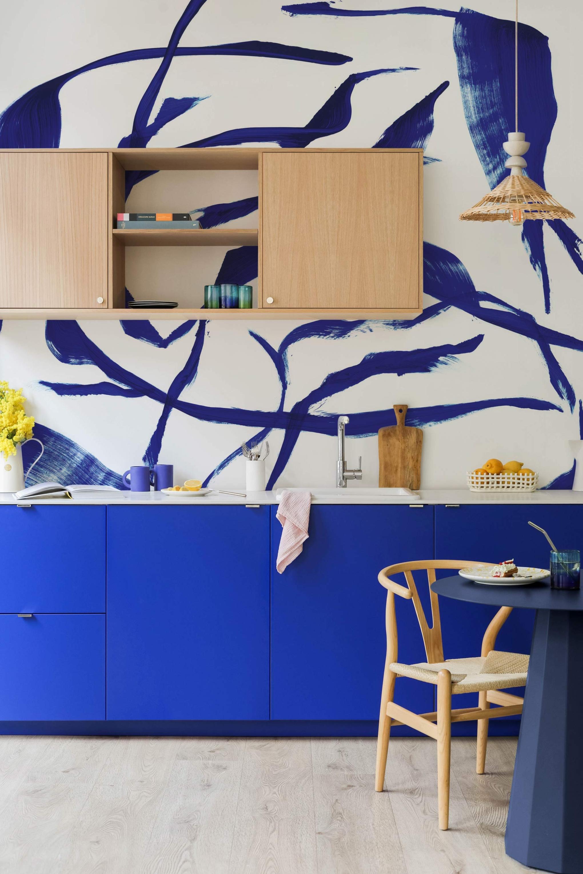 Kitchen in Electric Blue and Natural Oak with blue wallpaper